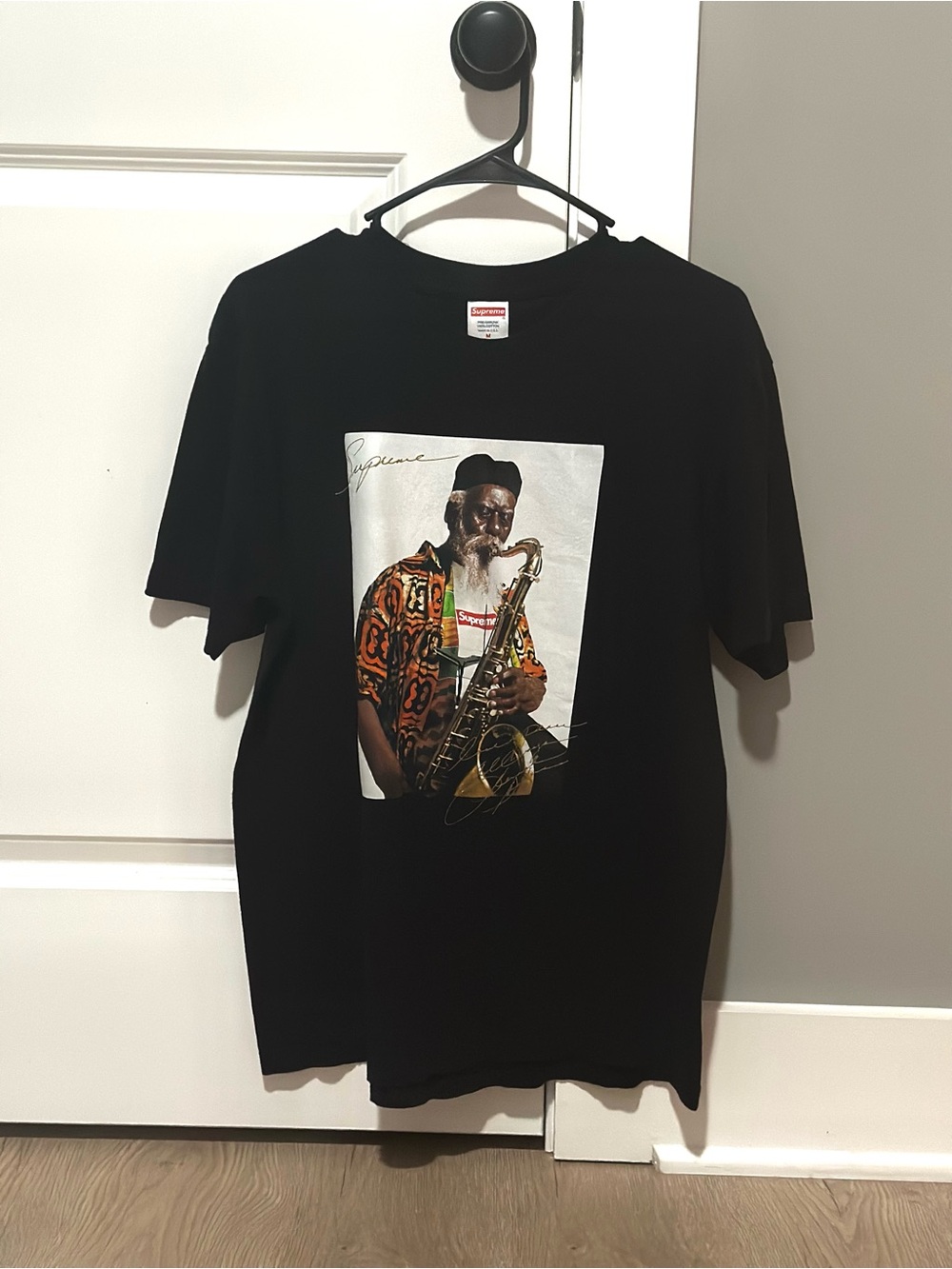 Supreme Black Tee with Colorful Saxophonist Photo Print